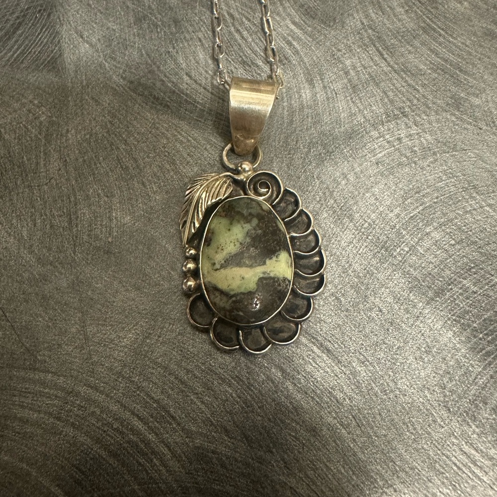 Elegant Silver Pendant with Green Stone